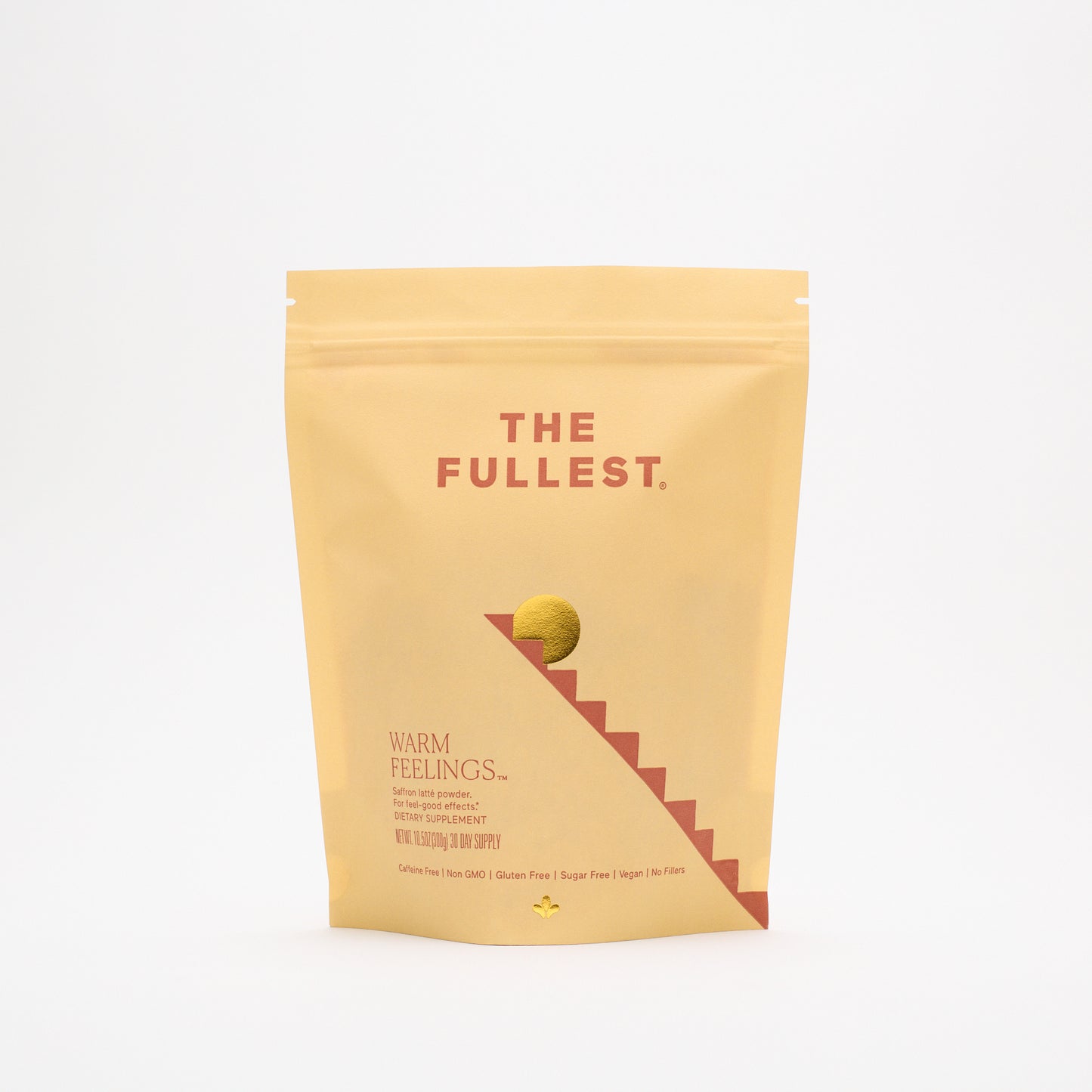A yellow resealable pouch labeled "THE FULLEST Saffron Latte 30-Day Supply" stands upright on a white background with minimalist graphics, highlighting it as a caffeine-free dietary supplement.