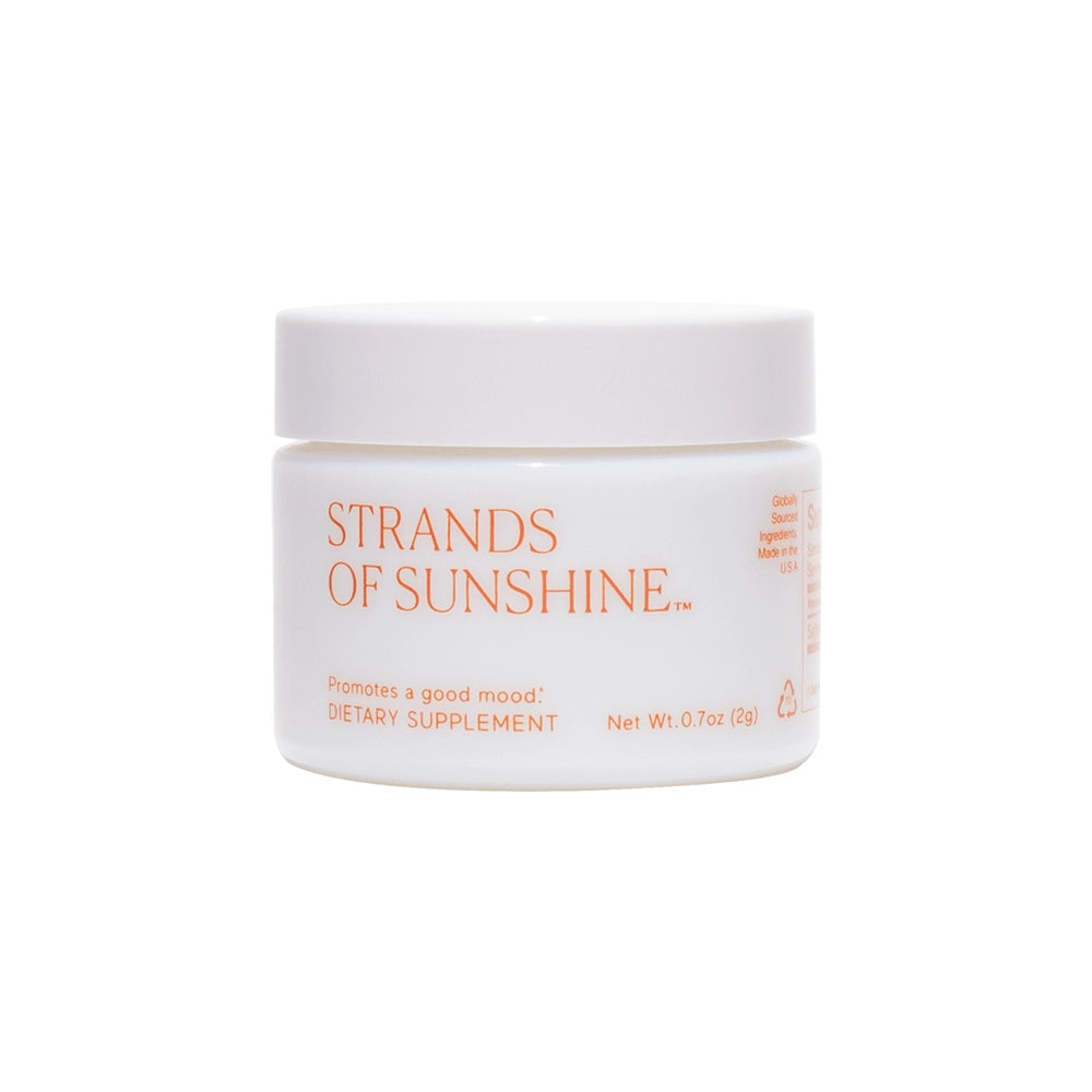 Container of "Strands of Sunshine" dietary supplement by THE FULLEST, containing pure saffron flower threads, against a white background.