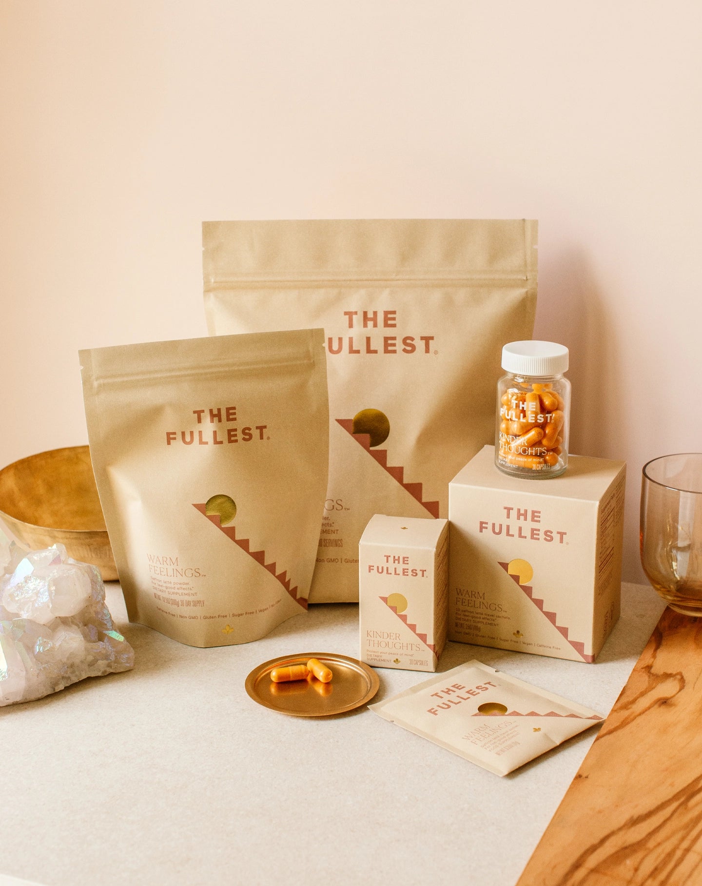 A group shot of all THE FULLEST products sitting on a counter and against a wall.