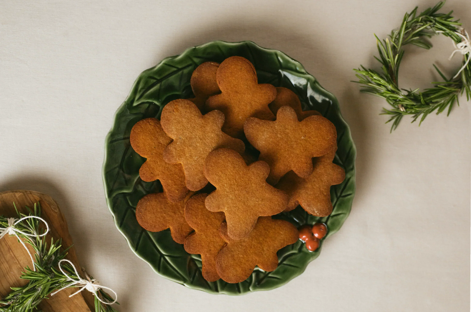 Saffron ginger bread cookies on a green Christmas plate with a neutral background 