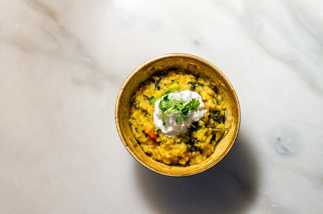 An overhead image of Saffron Kitchari in a bowl made with The Fullest saffron latte mix.
