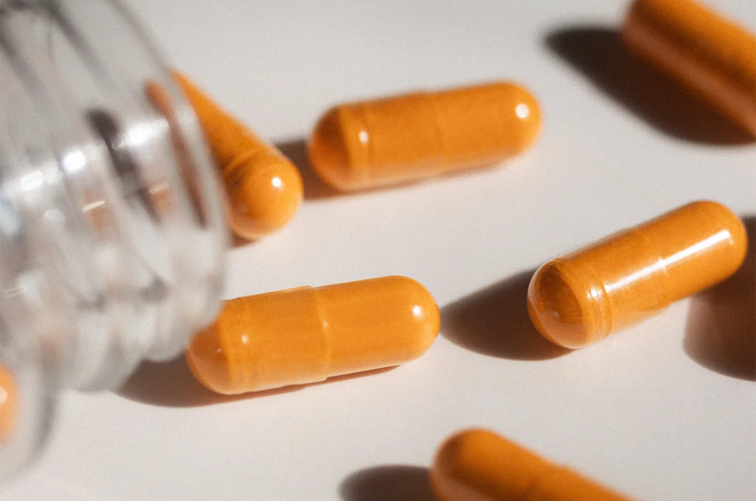 Saffron capsules spilled on a white table 