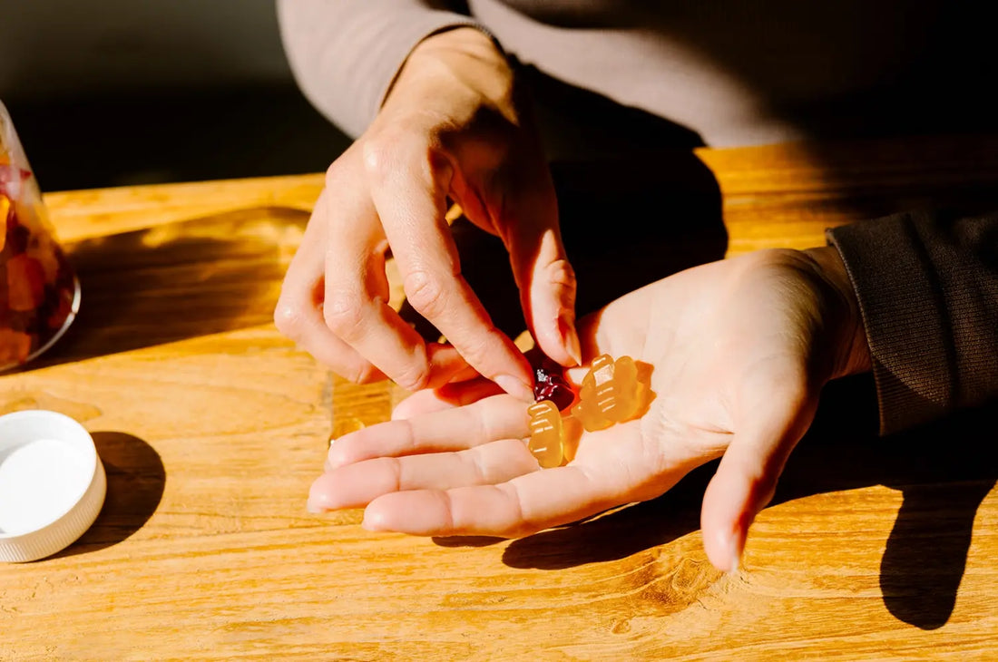 Saffron gummies in natural lighting over a wooden desk 