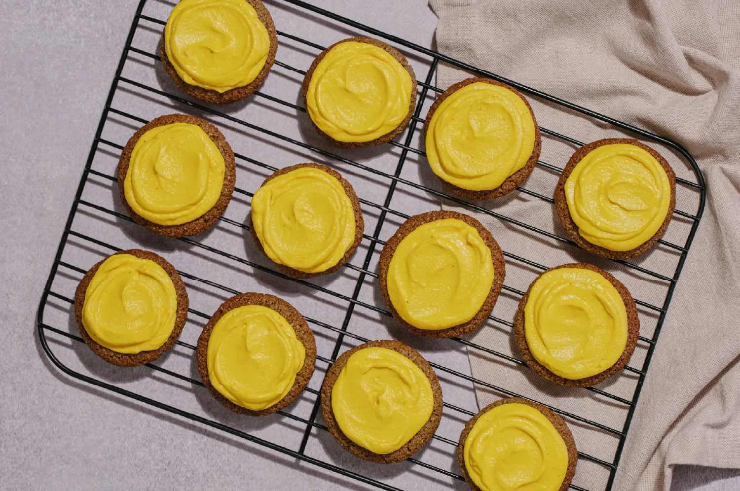 Charcoal Halloween Cookies with Golden Saffron Frosting