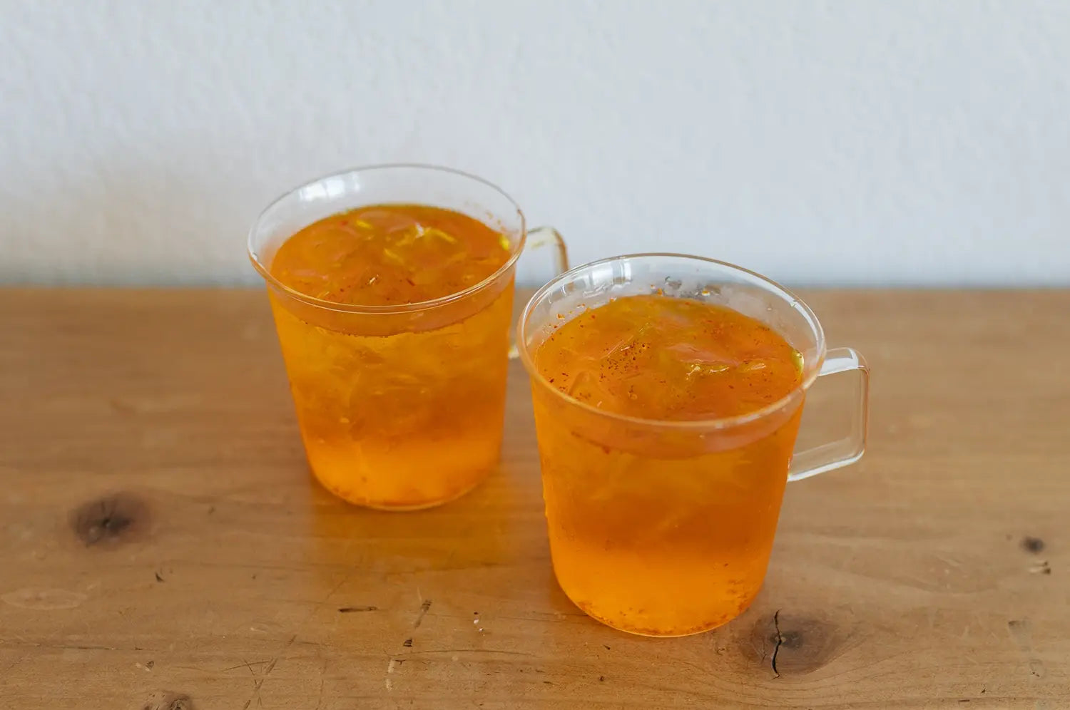 Persian hydrating tonic drink on a wooden table in clear mugs 