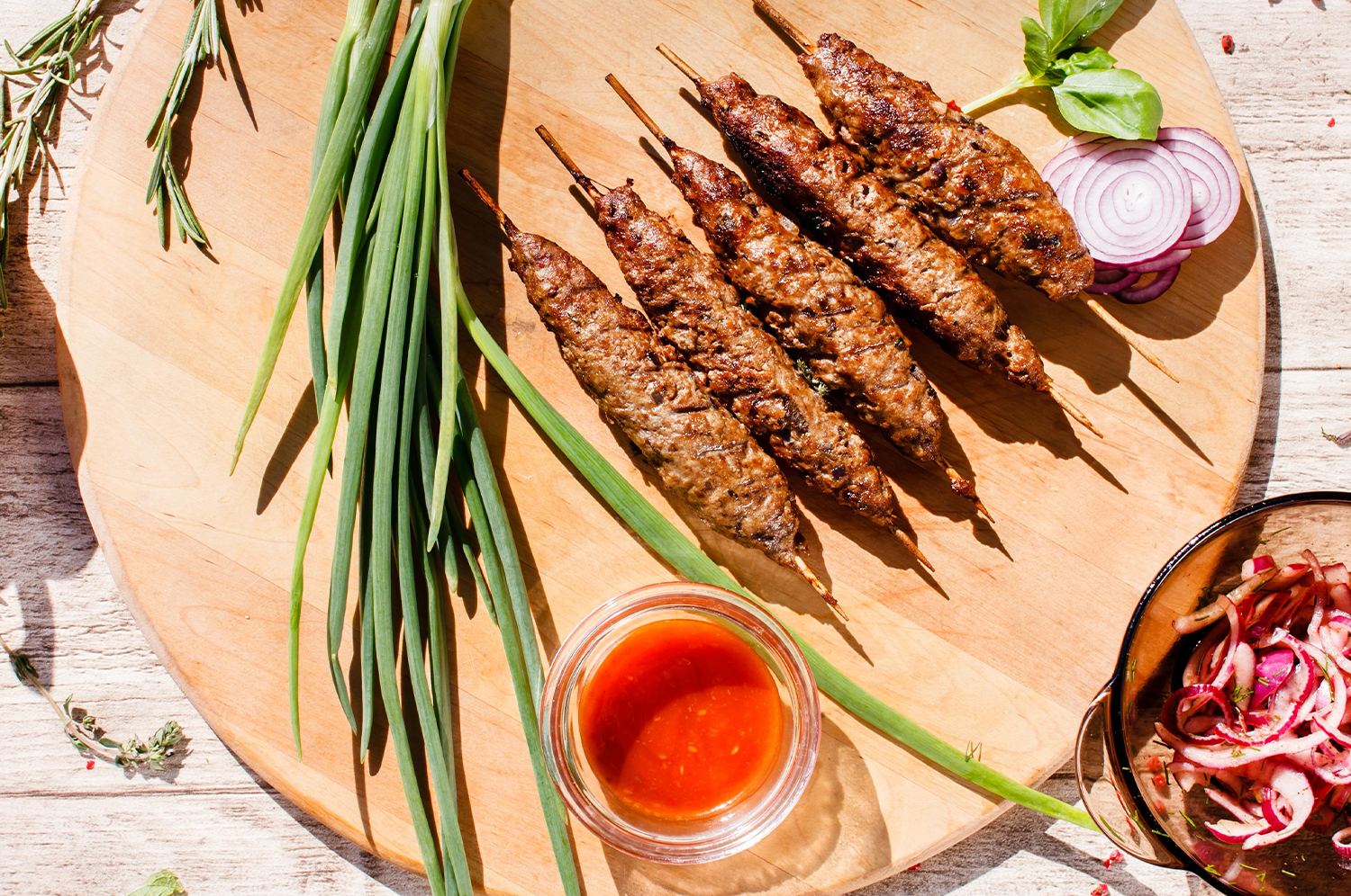  Persian-inspired kabob on a wooden cutting board with saffron extract 