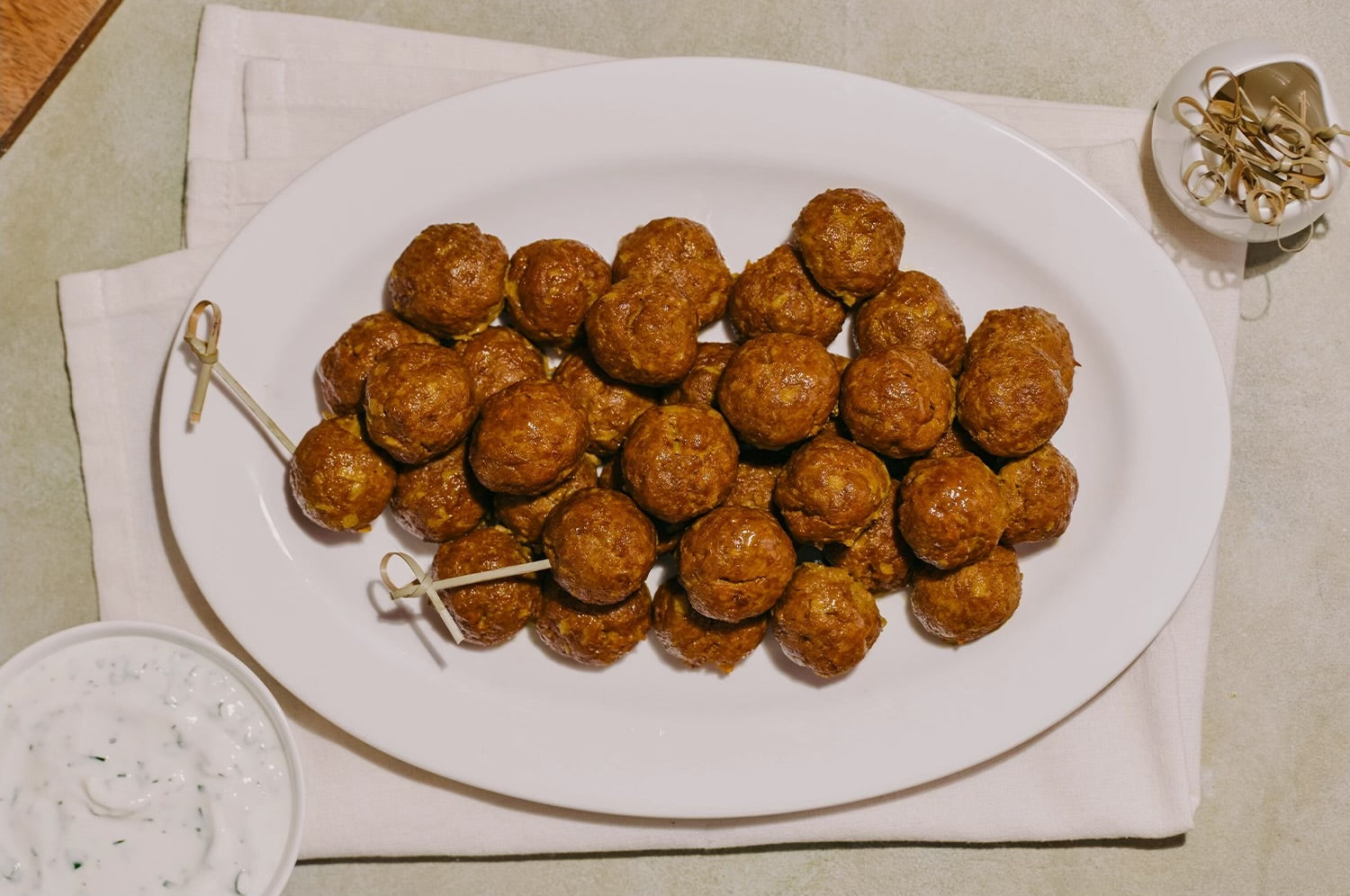 Plated saffron beef meatballs made with saffron capsules, garnished and ready to serve.