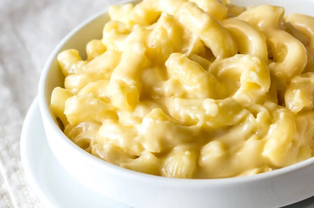 Creamy saffron macaroni and cheese in a white bowl
