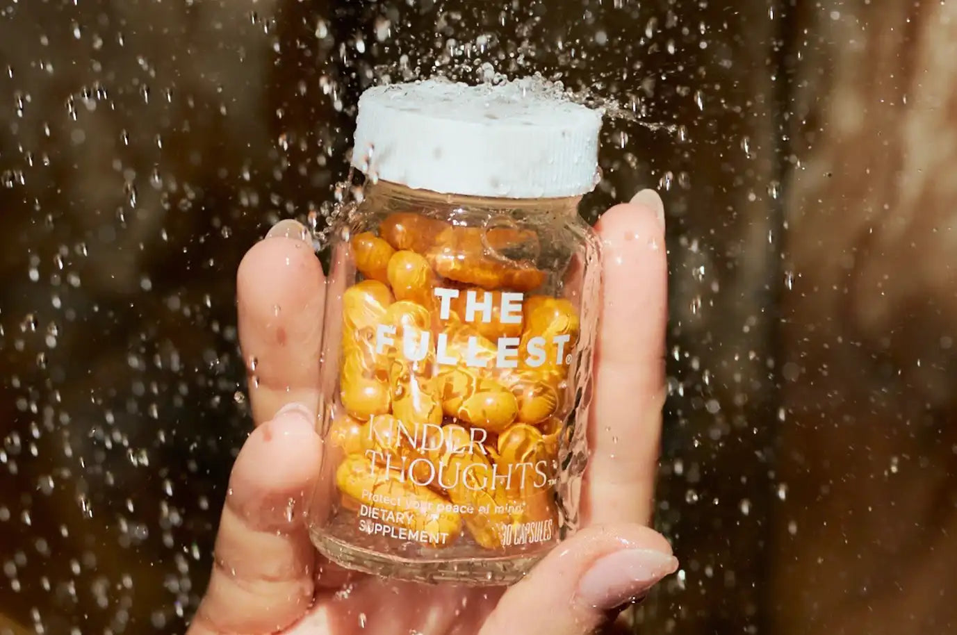 THE FULLEST Saffron Capsules shot up close with water droplets coming down 