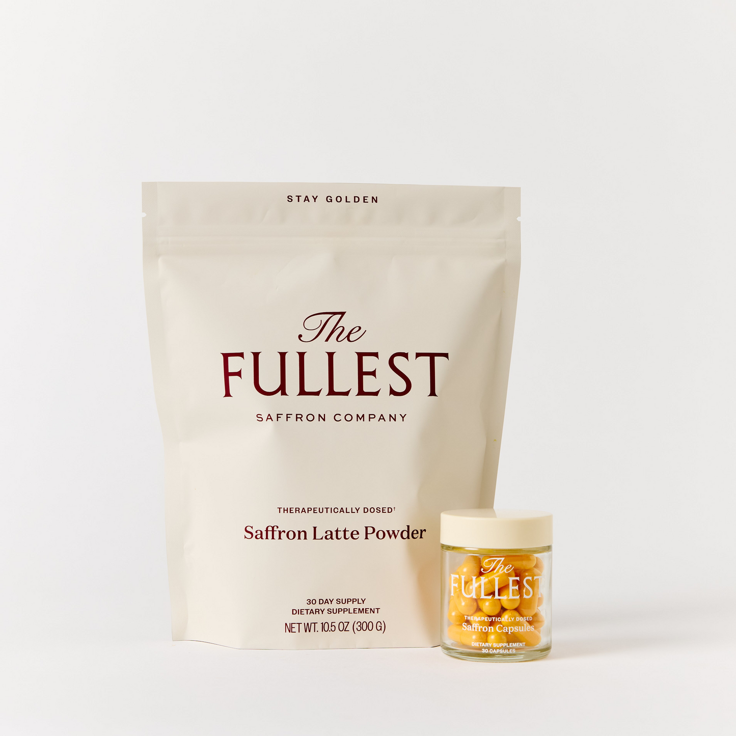 A beige pouch and a small jar, both labeled as part of the "Saffron Bundle" from THE FULLEST, are displayed on a plain light background, offering saffron supplements designed to support mood and restorative sleep.