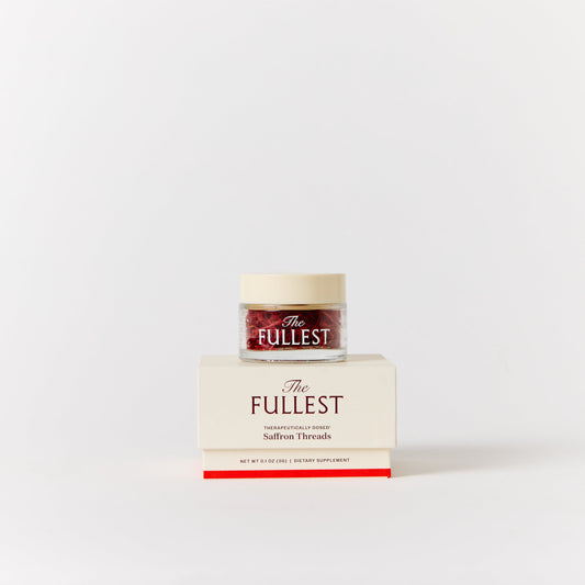 A small jar of The Fullest Saffron Threads sits on top of its cream-colored packaging box against a clean white background.