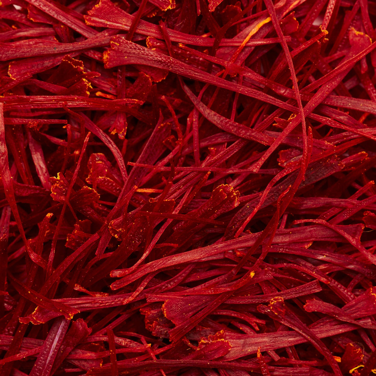 Close-up view of dried, deep red THE FULLEST Saffron Threads.