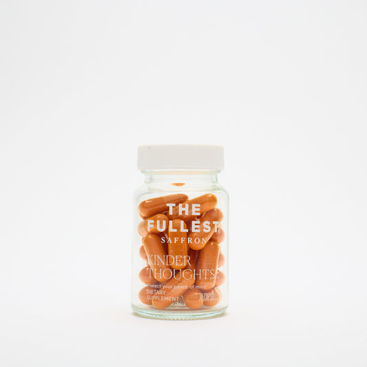A glass jar labeled "THE FULLEST Saffron Capsules" contains 30 saffron capsules for mood support and anxiety relief, set against a plain white background.