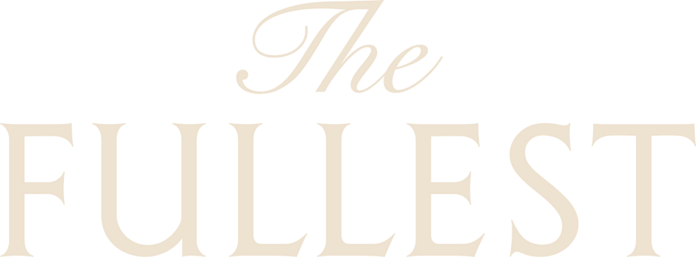 The image displays the words "The Fullest" in large, light beige serif font on a white background.
