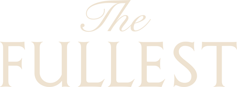 The image displays the words "The Fullest" in large, light beige serif font on a white background.