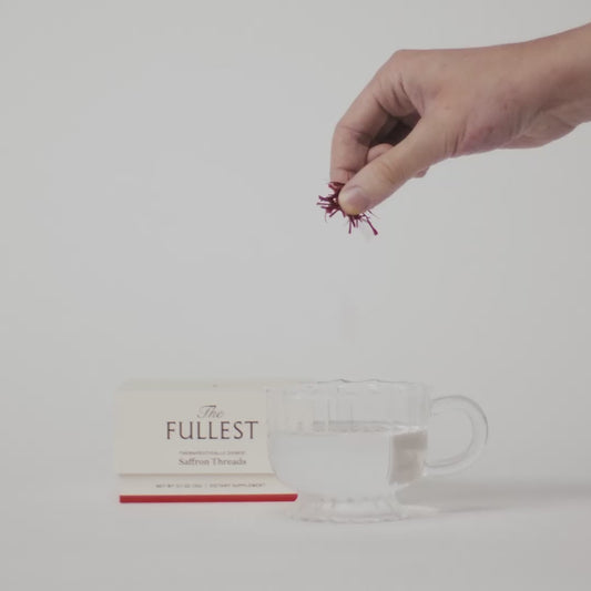 video of someone dropping saffron threads in water