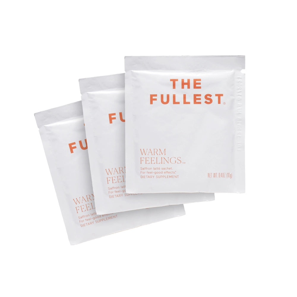 Three sachets of THE FULLEST brand Warm Feelings Sachet 3-Day Supply displayed in a neat arrangement on a white background, offering mood improvement with their caffeine-free saffron latte