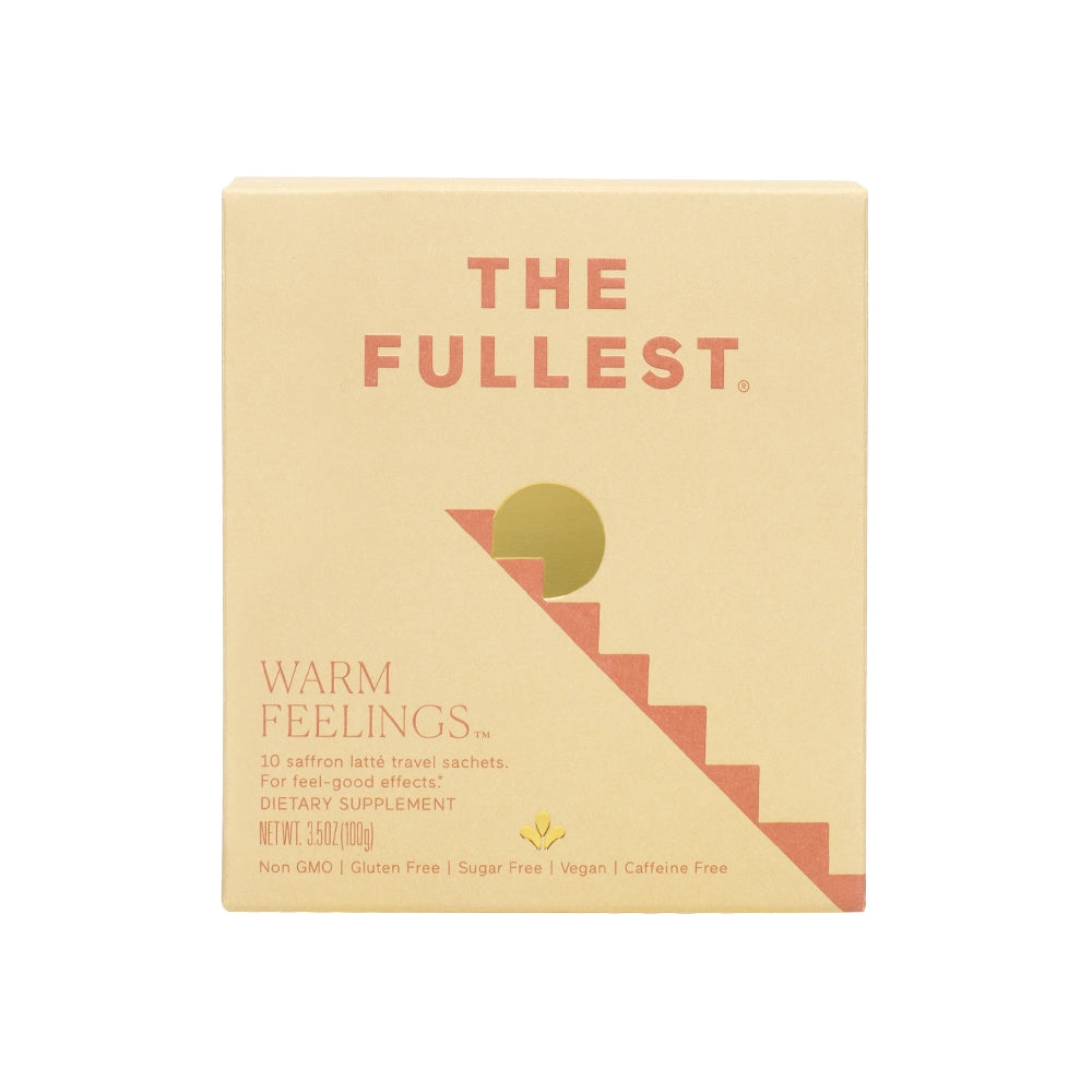 A box of &quot;Warm Feelings Sachet&quot; caffeine-free saffron lattes with dietary supplement details, labeled vegan, non-gmo, gluten-free, and sugar-free by THE FULLEST.